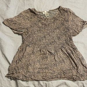 Beautiful animal print tan top pairs perfect with high waisted jeans